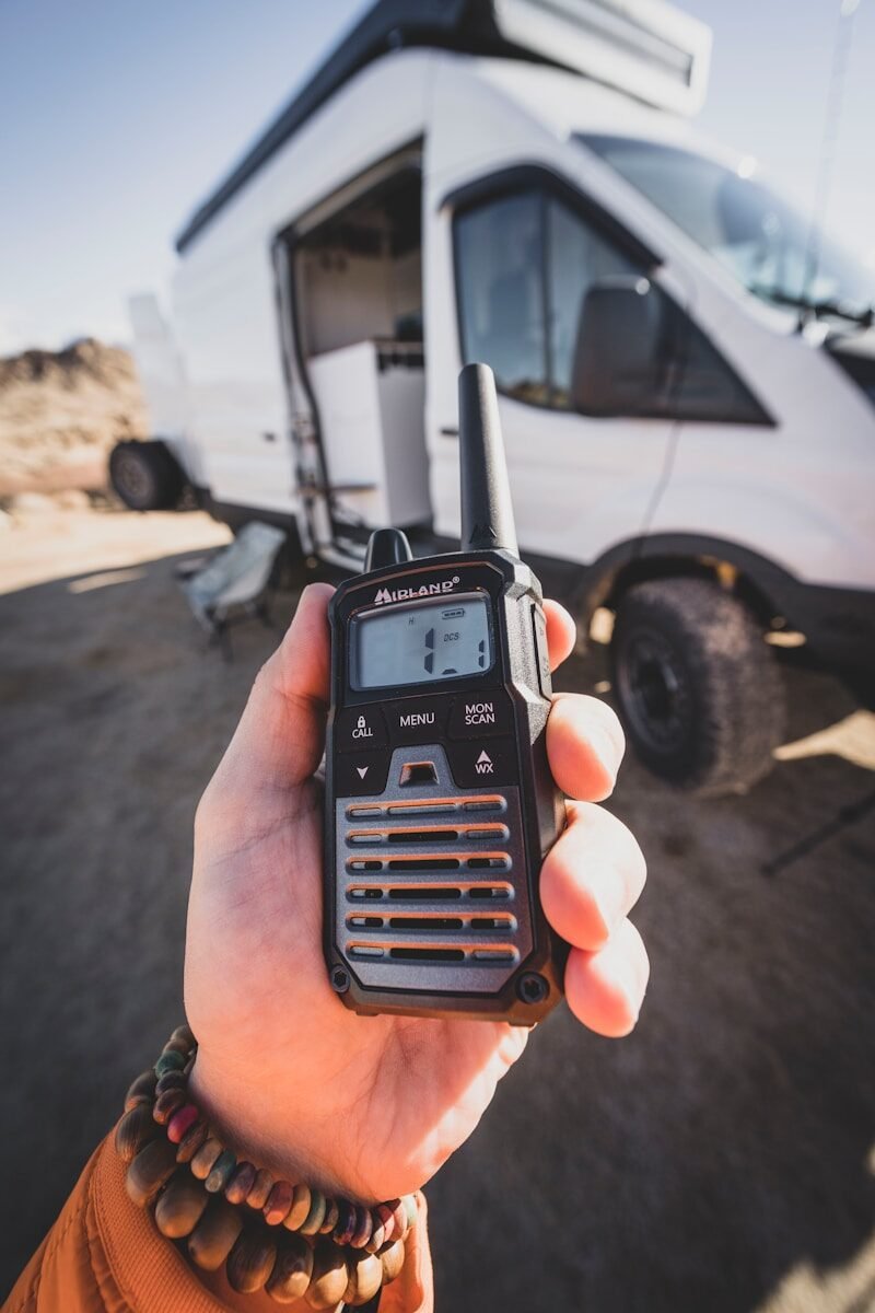 a person holding a radio in their hand